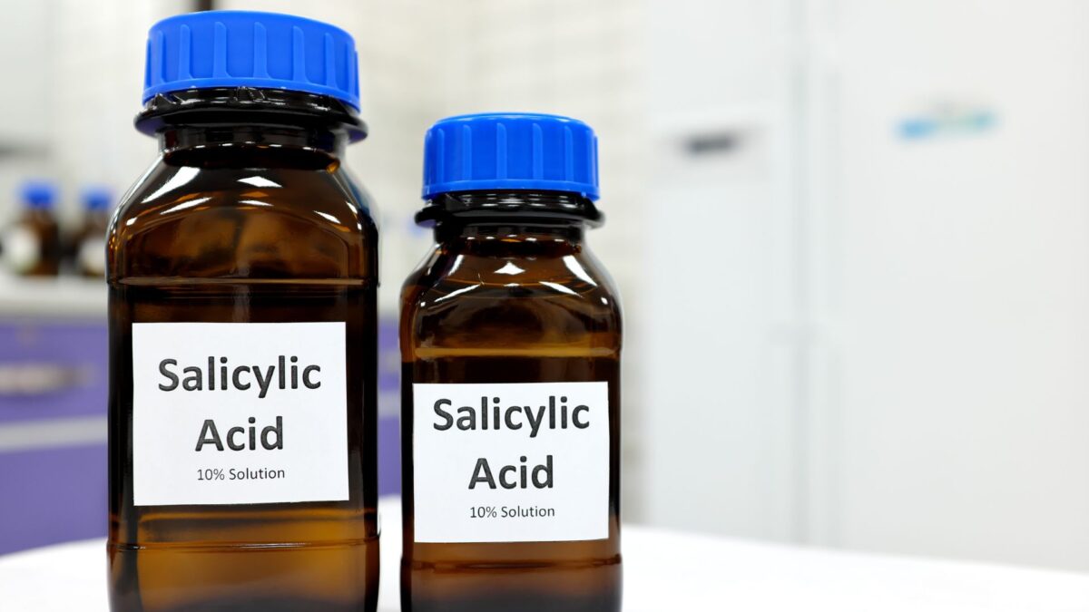 salicylic acid for acne treatment with visible pimples and skincare application
